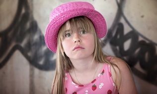 cute young girl in pink hat