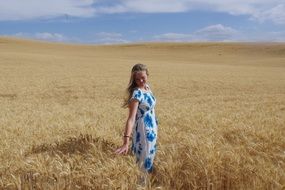 girl in golden wheat field