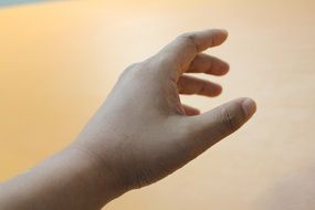 baby hand photo on beige background