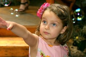 girl playing soap bubbles