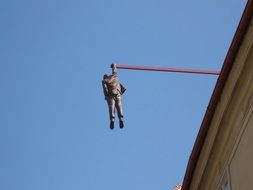 sculpture of Man hanging on stick in Prague