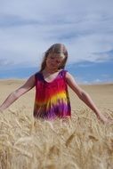 blonde girl in a wheat field