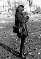 Black and white photo of the girl with the phone