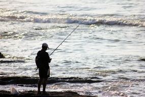 fisherman on the ocean coast