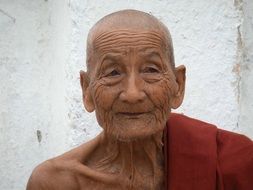 a wise face of the elderly monk