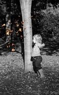 boy in autumn park in black and white tone