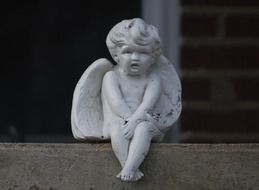 sculpture of a white angel as decoration