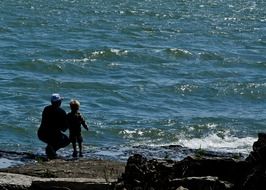 father and son at the water