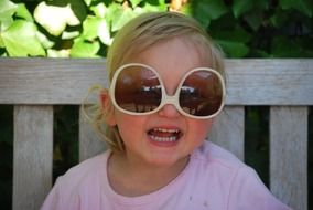 cheerful child in sunglasses