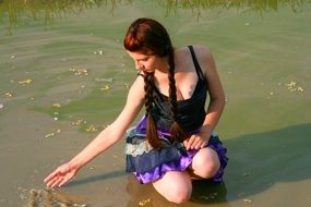 girl with long hair on a background of lake