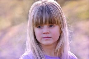 portrait of a pensive girl with long white hair