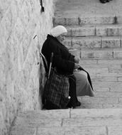 old lady on the stairs in Jerusalem