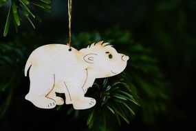 wooden small polar bear on the christmas tree