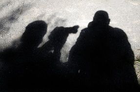 shadow photographer with camera