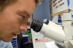 people scientist microscope