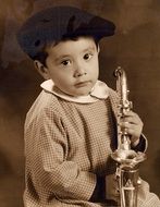 little boy with saxophone, sepia