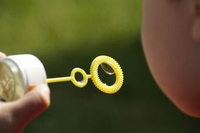 a child making soap bubbles