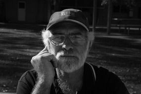 man with a gray beard black and white photo
