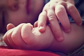 caucasian baby fingers close up