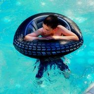 girl on a rubber ring in the pool