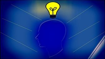 drawn head profile and yellow light bulb