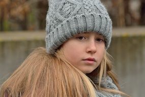 Long hair blond Girl in grey hat