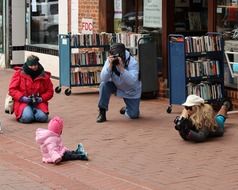 photographers shooting a child