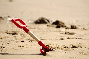 children's shovel in the sand