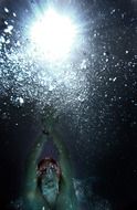 underwater photo of a swimmer in the ocean