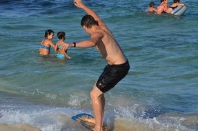 Skim boarding in water