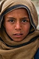 dirty face of afghan boy