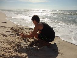 building a sand castle on the beach in California