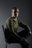 portrait of a man on a chair