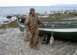 Photo of a local fisherman on a boat in Iceland