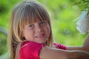 little girl blonde with blue eyes smiling