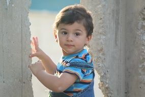child between concrete walls in iraq