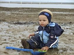 child playing in a dirt
