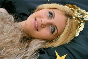 blue-eyed blonde with a crown on her head