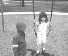 children play on the swing