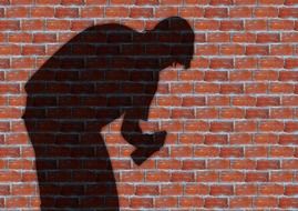 shadow of a man on a brick wall background