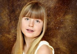 child girl blond long hair with tiny freckles in her face