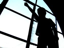 a silhouette of a child-winner