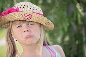 photo of the blond child on a blurred background