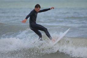 surfer man waves on the sea