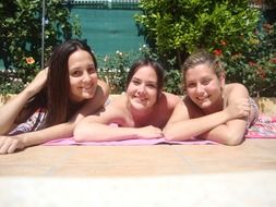 girlfriends girls lie on the beach