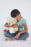 girl with a white teddy bear