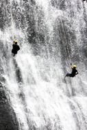 rock climbers on a high waterfall
