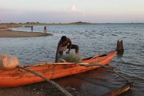 fisherman in the boat in lake