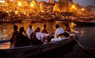 people in a boat are sailing on a river in India