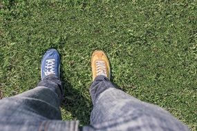 man&#039;s legs in different shoes